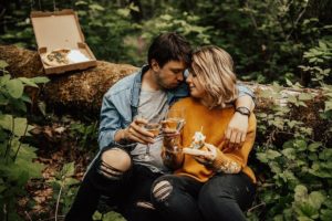couple in the woods with pizza