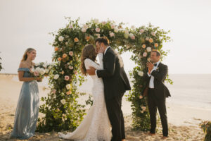 bride and groom kissing during wedding ceremony in cape may, New Jersey